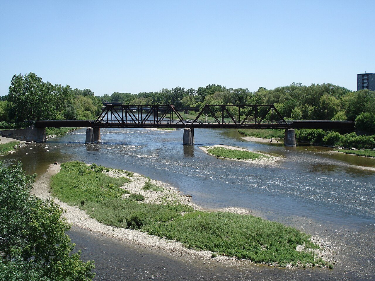The Grand River in Brantford with a steel railway bridge